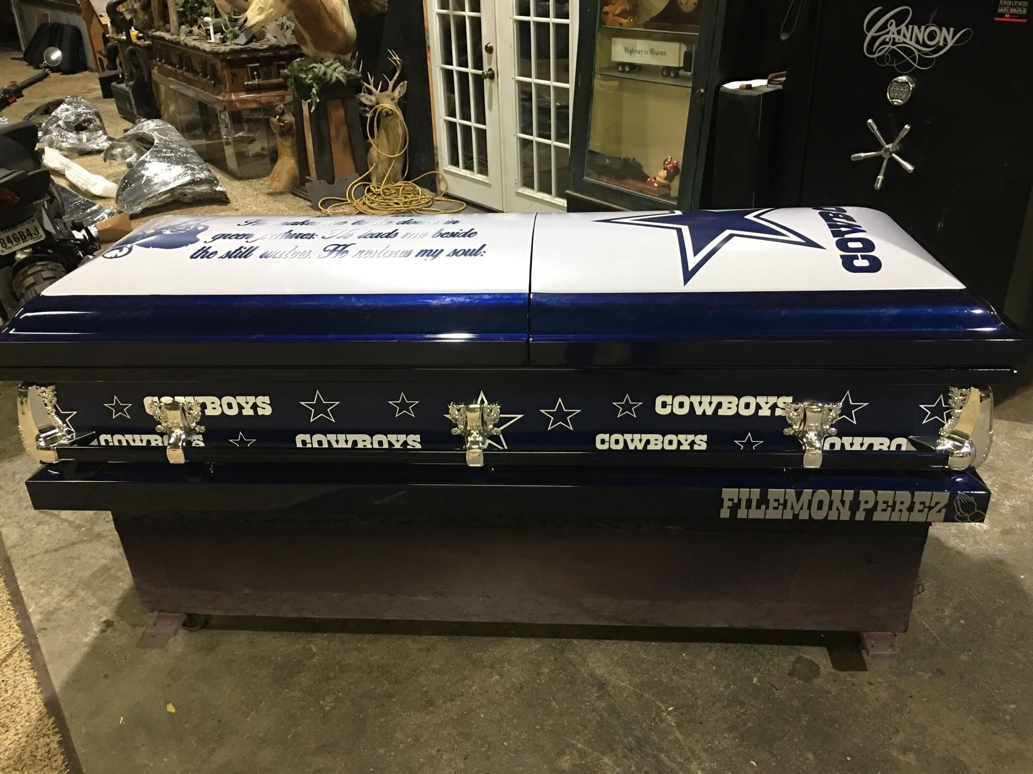 Navy Cowboys casket ringed with stars and COWBOYS lettering, named for Filemon Perez