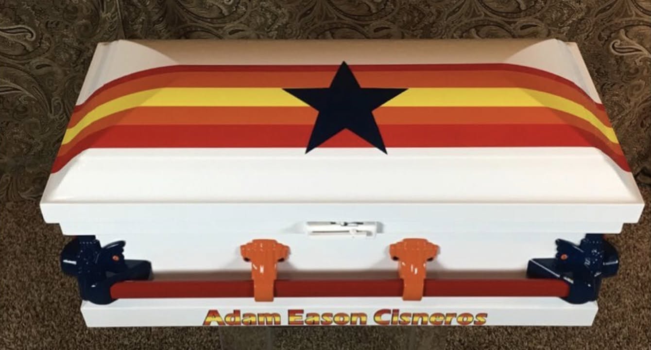 White casket with retro orange and yellow Astros stripes, a navy star and Adam Eason Cisneros