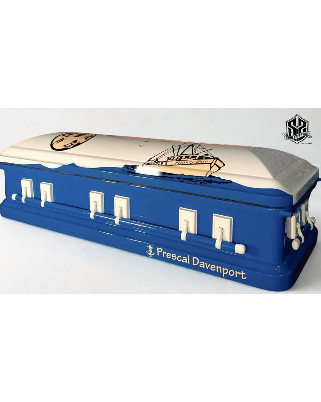 Royal blue and cream casket wrapped with the shrimp boat Nancy Sue and lettered Prescal Davenport