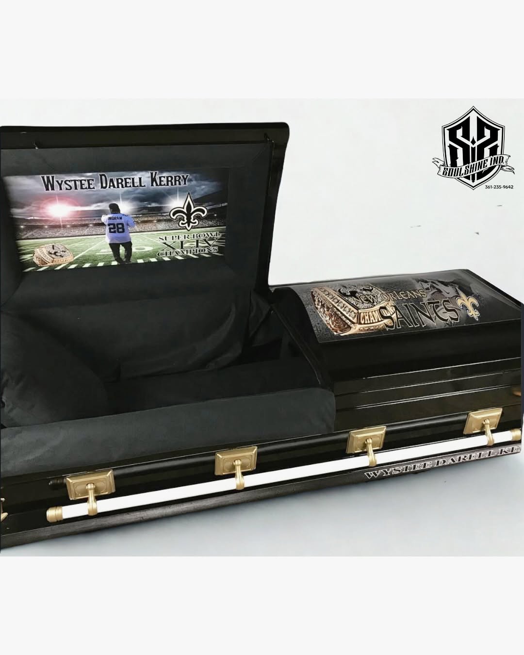 Glossy black casket topped with a gold New Orleans Saints logo for Wystee Darell Kerry