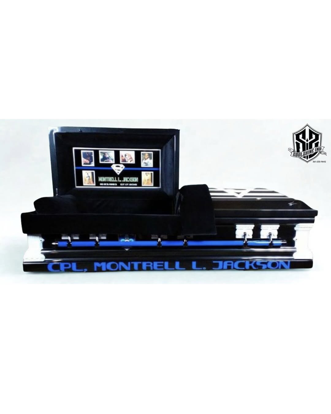 Black casket with a thin blue line stripe and CPL. MONTRELL L. JACKSON lettered for a fallen officer