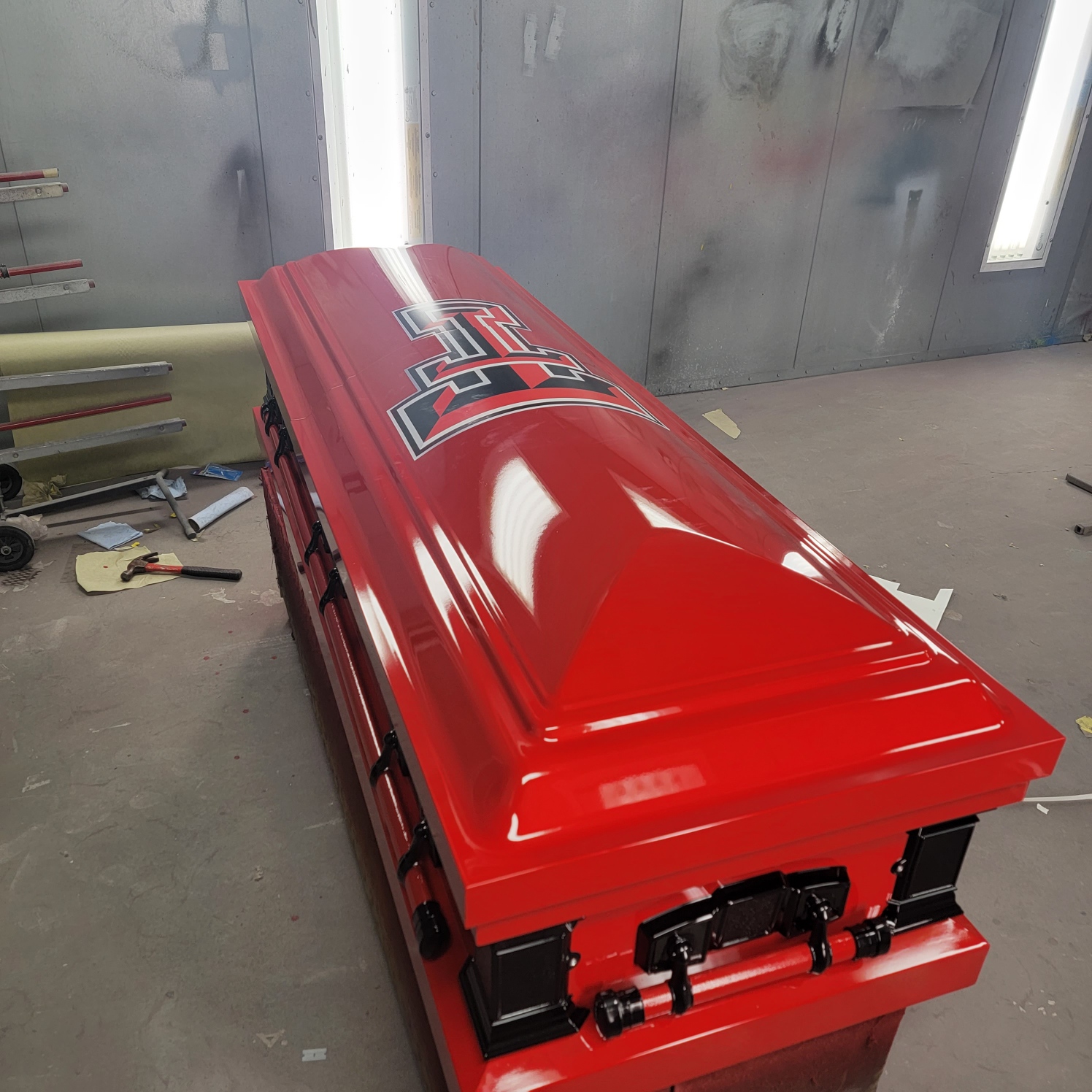 Candy red casket wrapped with the Texas Tech Double T logo, from SoulShine in Victoria, Texas