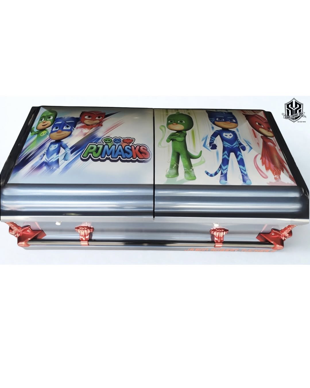 Silver child casket with PJ Masks characters printed on the lid and rose colored handles