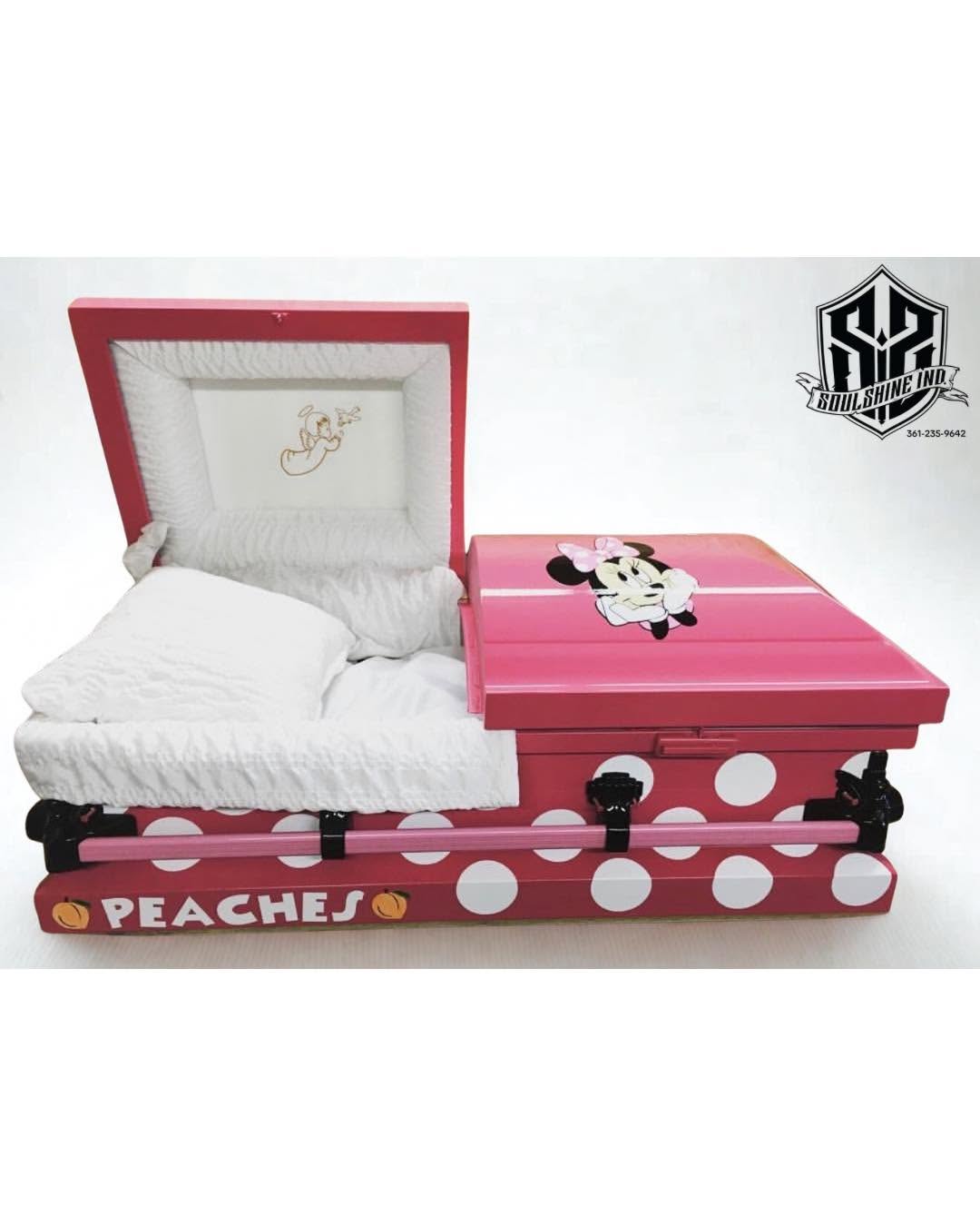 Pink polka dot Minnie Mouse child casket named Peaches, open with white shirred lining