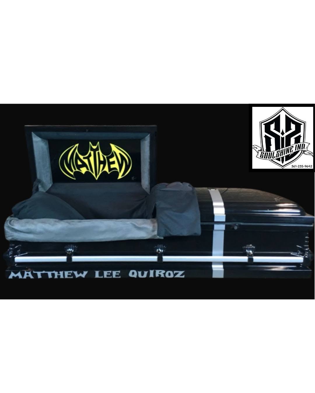 Black Batman child casket lettered Matthew Lee Quiroz with a yellow bat crest in the lid panel
